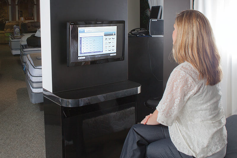 customer with a salesperson discussing their sleep profile